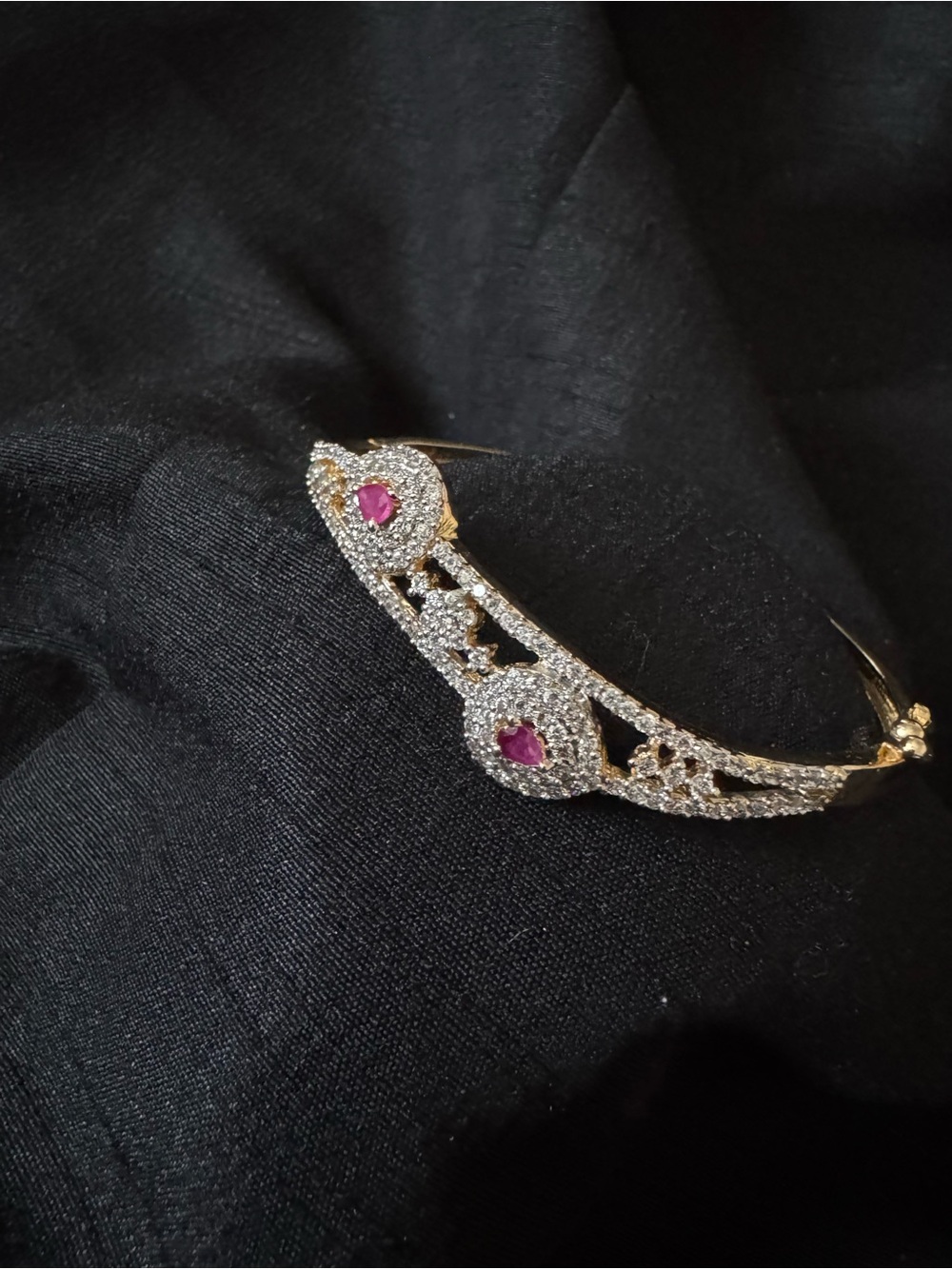 Gold Tone Bangle Bracelet with Pink Gem Accents